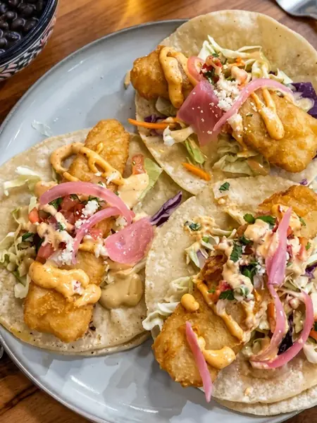 Baja fish tacos with cabbage, pickled onion and chipotle mayo at MEXIKAN in Chappelle, Edmonton