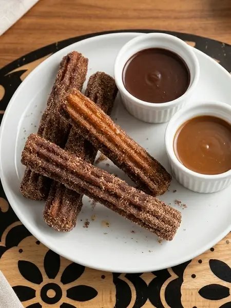 Churros with chocolate and caramel dipping sauces at MEXIKAN in Chappelle, Edmonton