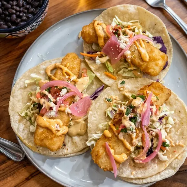 Baja fish tacos with cabbage, pickled onion and chipotle mayo at MEXIKAN in Chappelle, Edmonton