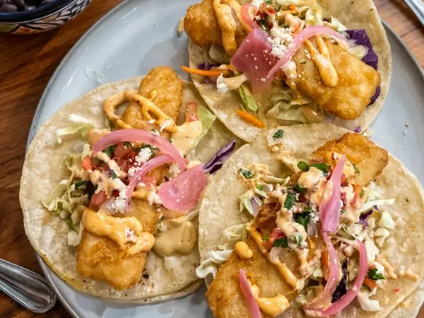 Baja fish tacos with cabbage, pickled onion and chipotle mayo at MEXIKAN in Heritage Valley, Edmonton